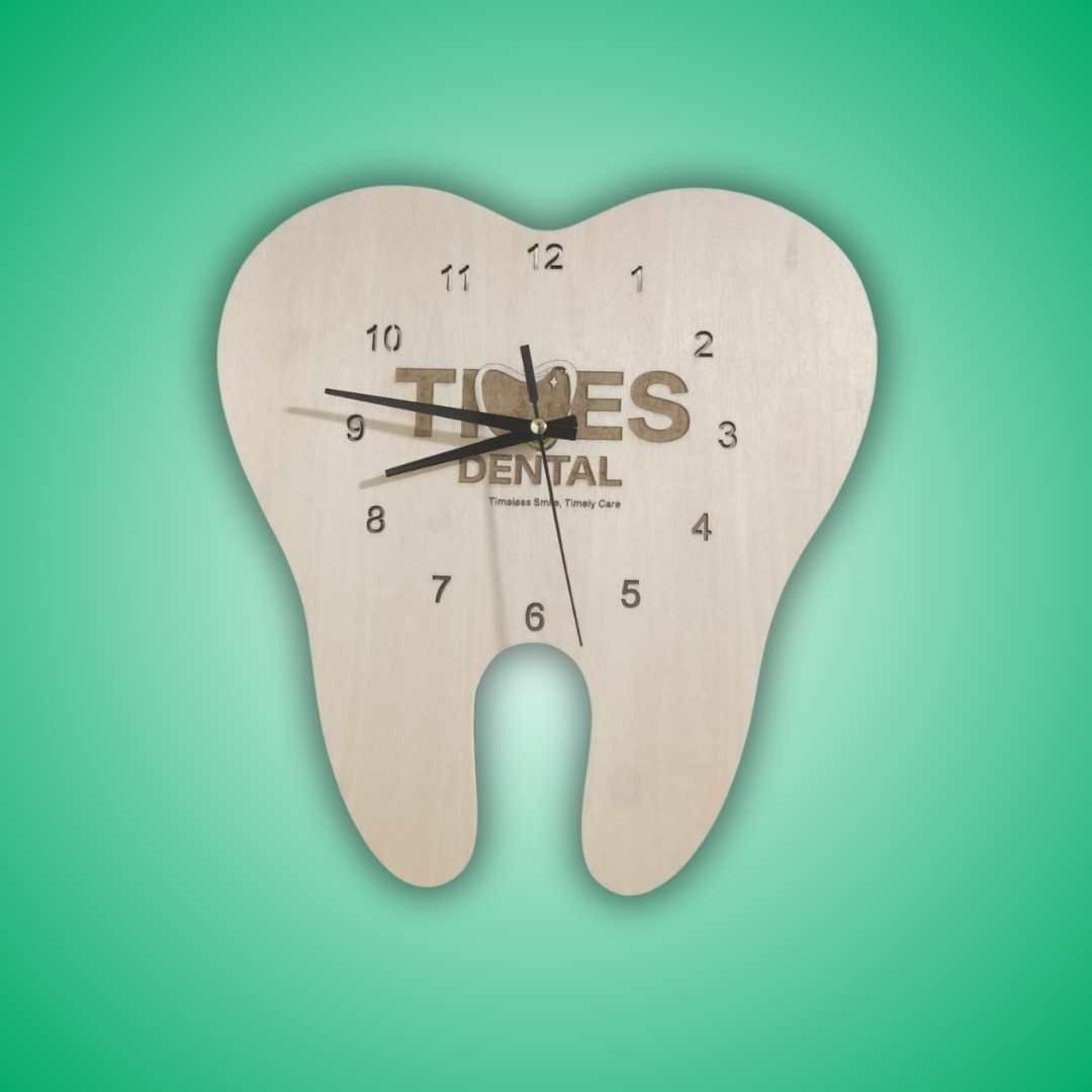 Tooth-shaped clock with dental clinic logo and numbers, set against a gradient green background.